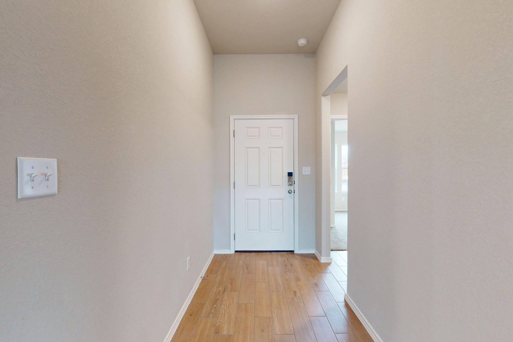 20009 Hirono Drive Manor, TX 78653 - Photo 22 of 39 a view of a hallway with wooden floor