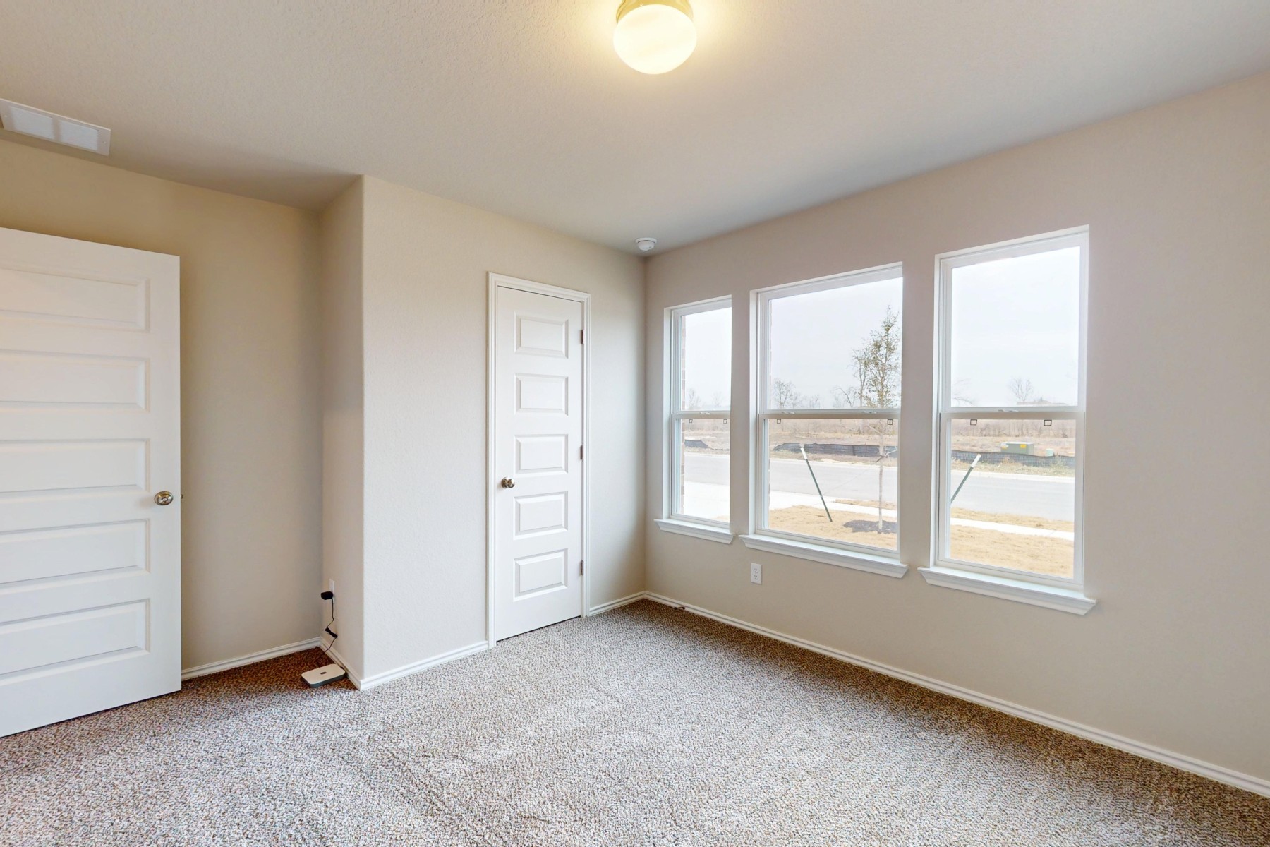 20009 Hirono Drive Manor, TX 78653 - Photo 23 of 39 an empty room with windows