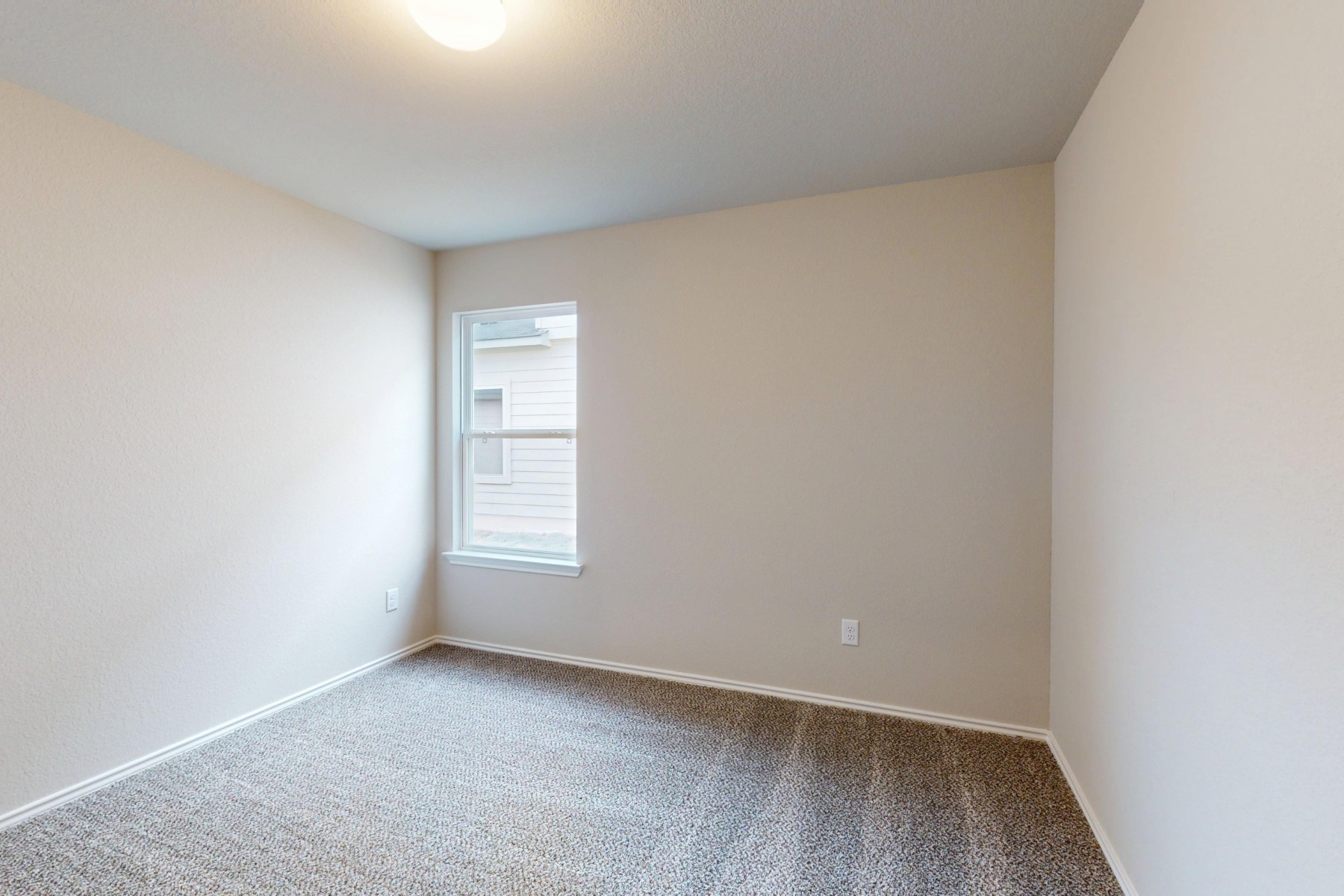 20009 Hirono Drive Manor, TX 78653 - Photo 30 of 39 a view of an empty room with wooden floor and a window