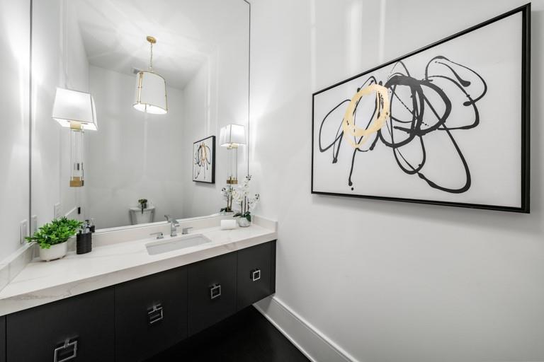 5211 Powers Ferry Road Northwest Sandy Springs, GA 30327 - Photo 64 of 106 a bathroom with a sink vanity and a mirror