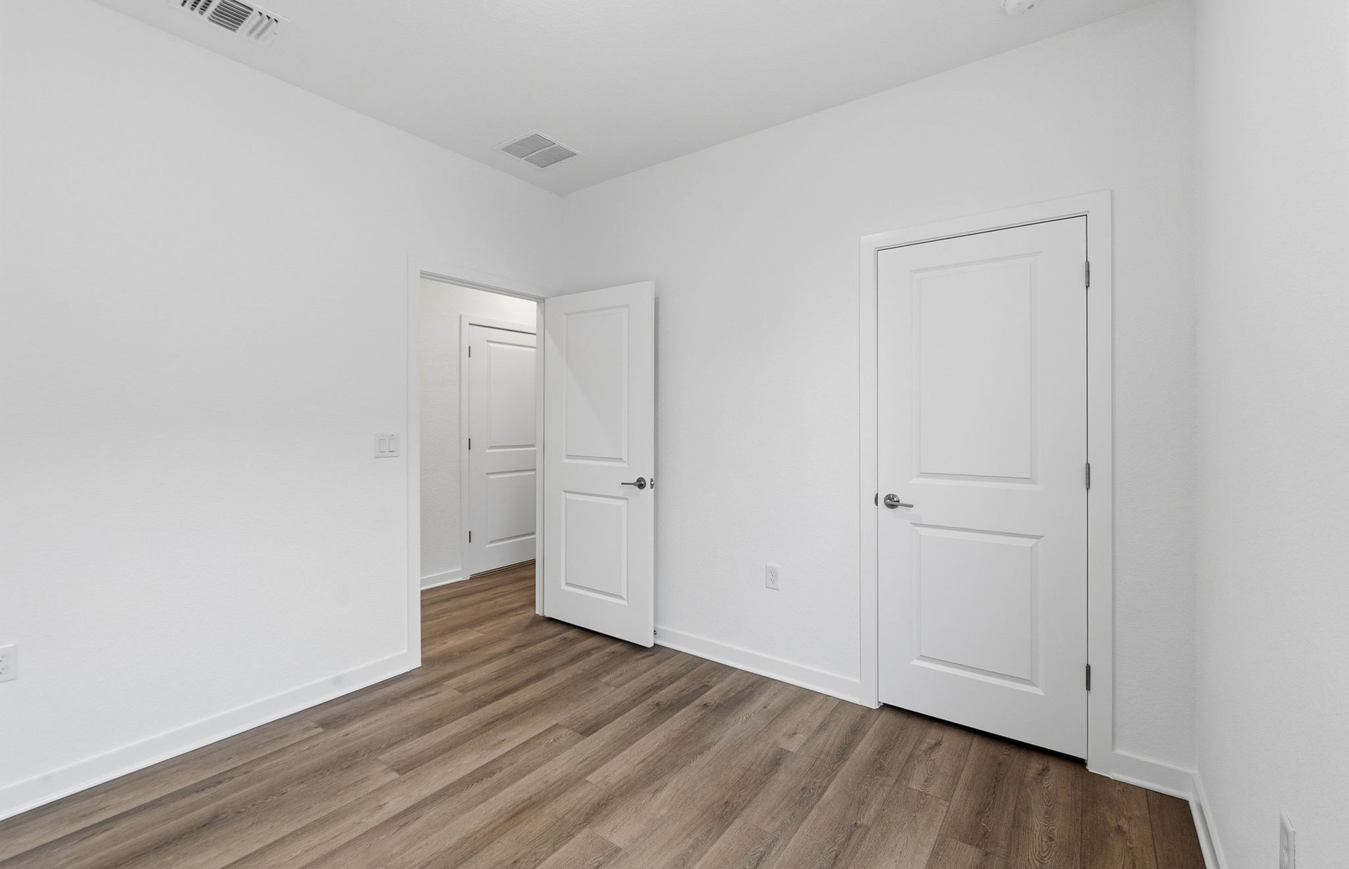 1010 Martingale Street Georgetown, TX 78633 - Photo 17 of 23 an empty room with wooden floor