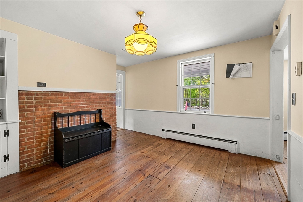 600 Main Street Ashby, MA 01431 - Photo 10 of 40 a view of an empty room with a window and wooden floor