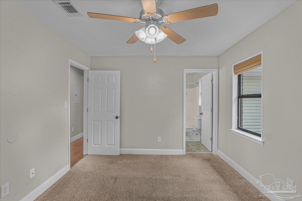 5946 Greenfield Street Pace, FL 32571 - Photo 34 of 42 a view of an empty room with a window