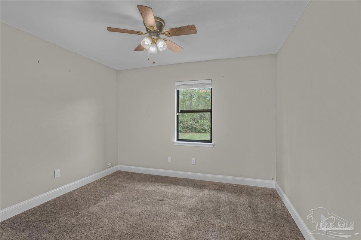 5946 Greenfield Street Pace, FL 32571 - Photo 36 of 42 an empty room with a window