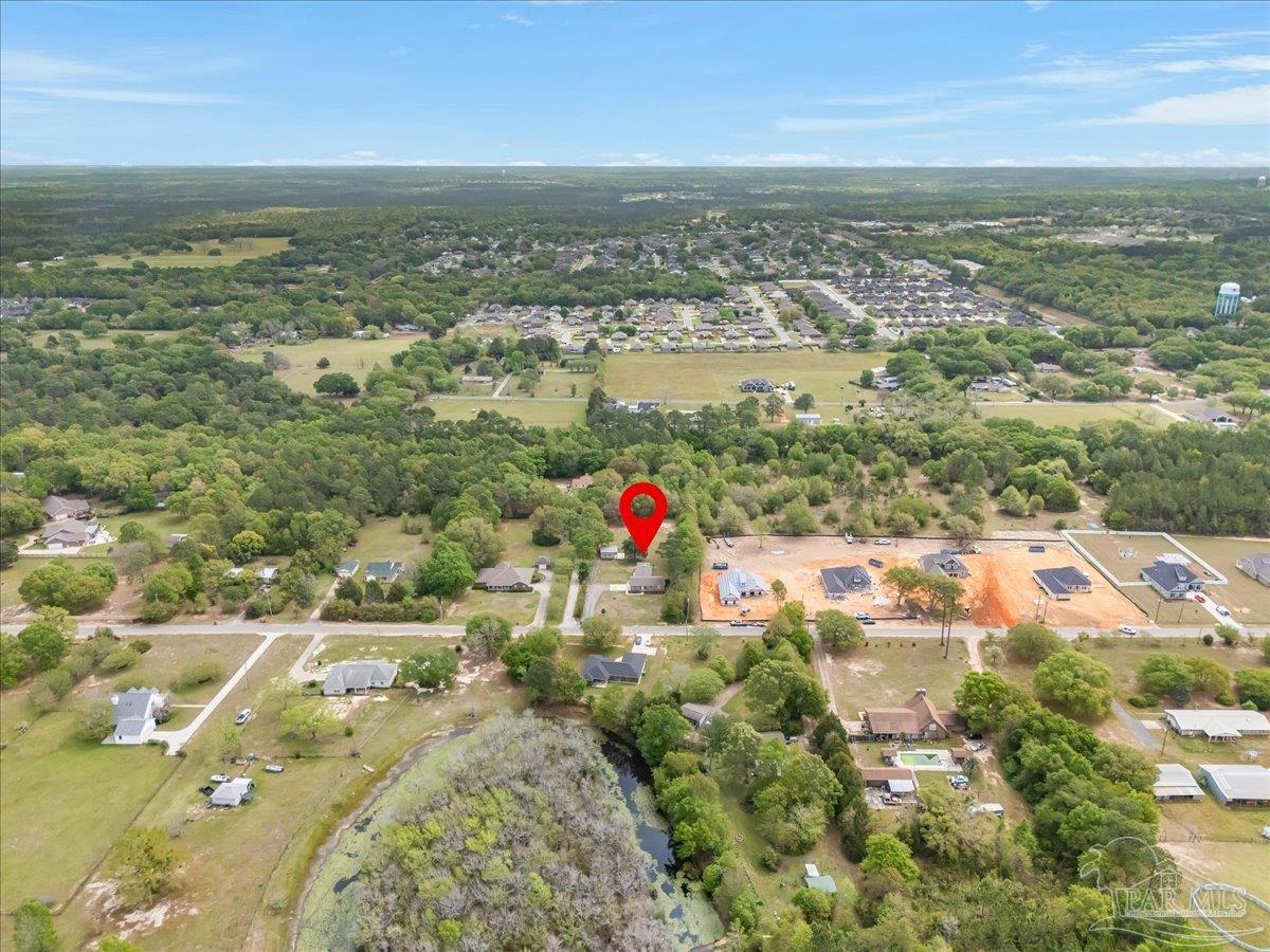 5946 Greenfield Street Pace, FL 32571 - Photo 40 of 42 an aerial view of residential houses with outdoor space