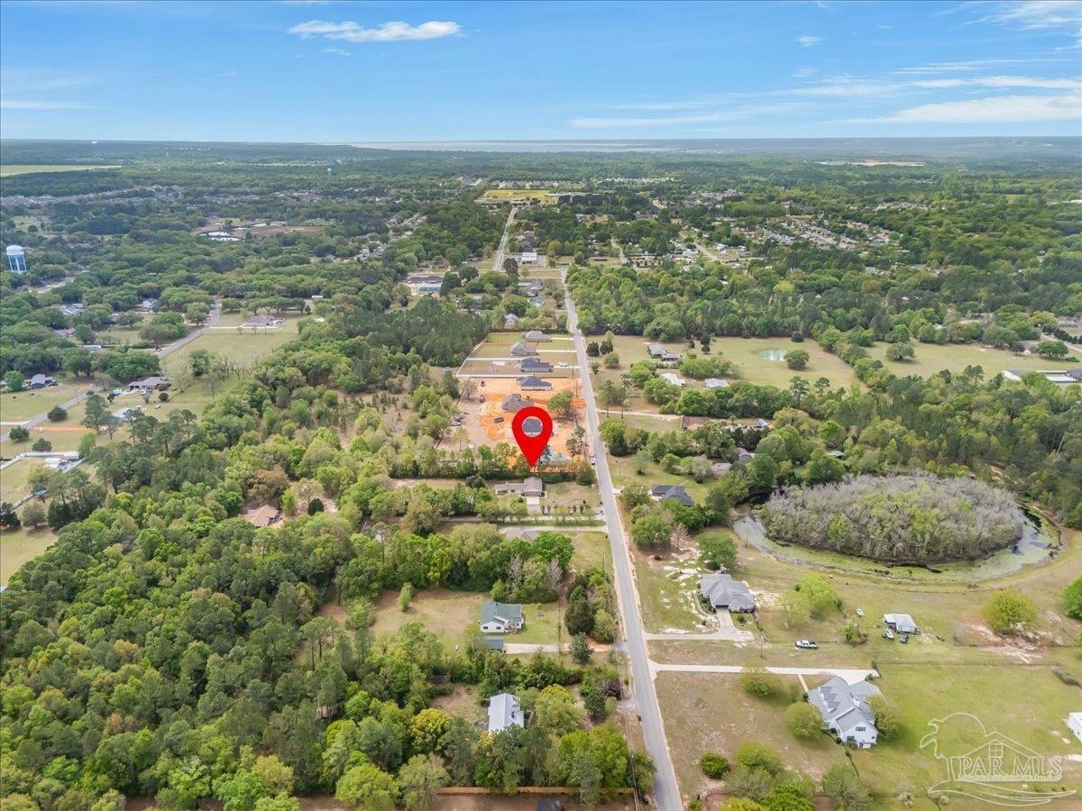5946 Greenfield Street Pace, FL 32571 - Photo 41 of 42 an aerial view of residential houses with outdoor space