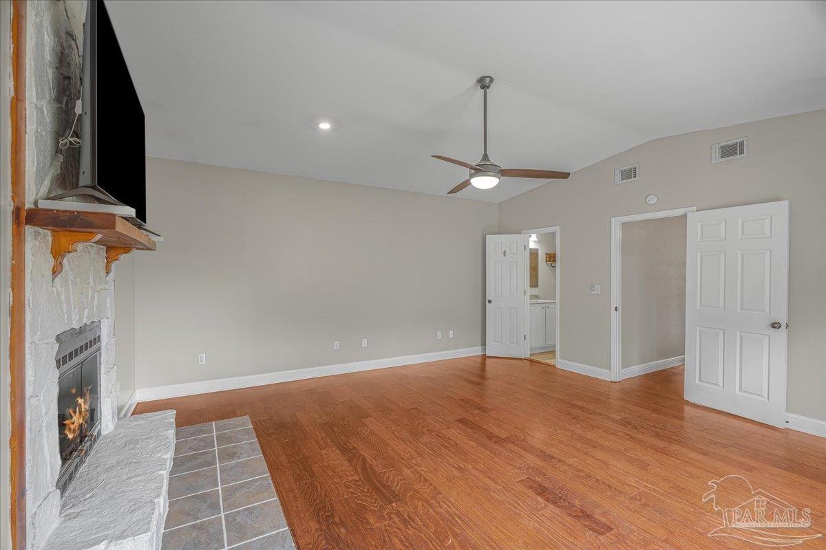 5946 Greenfield Street Pace, FL 32571 - Photo 10 of 42 a view of an empty room with a fireplace