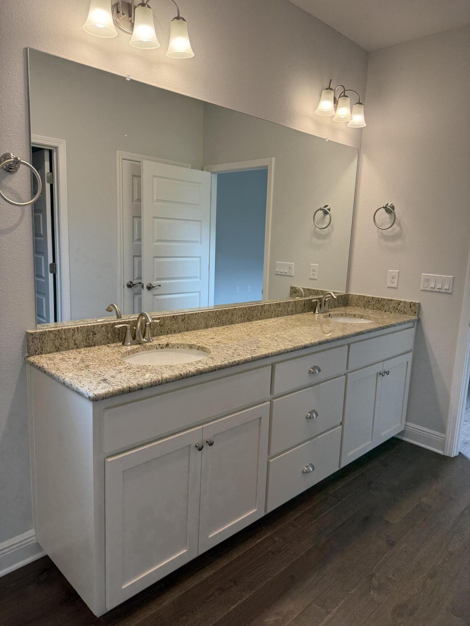 185 Ridgeway Circle Crestview, FL 32536 - Photo 17 of 30 a bathroom with a granite countertop sink and a mirror