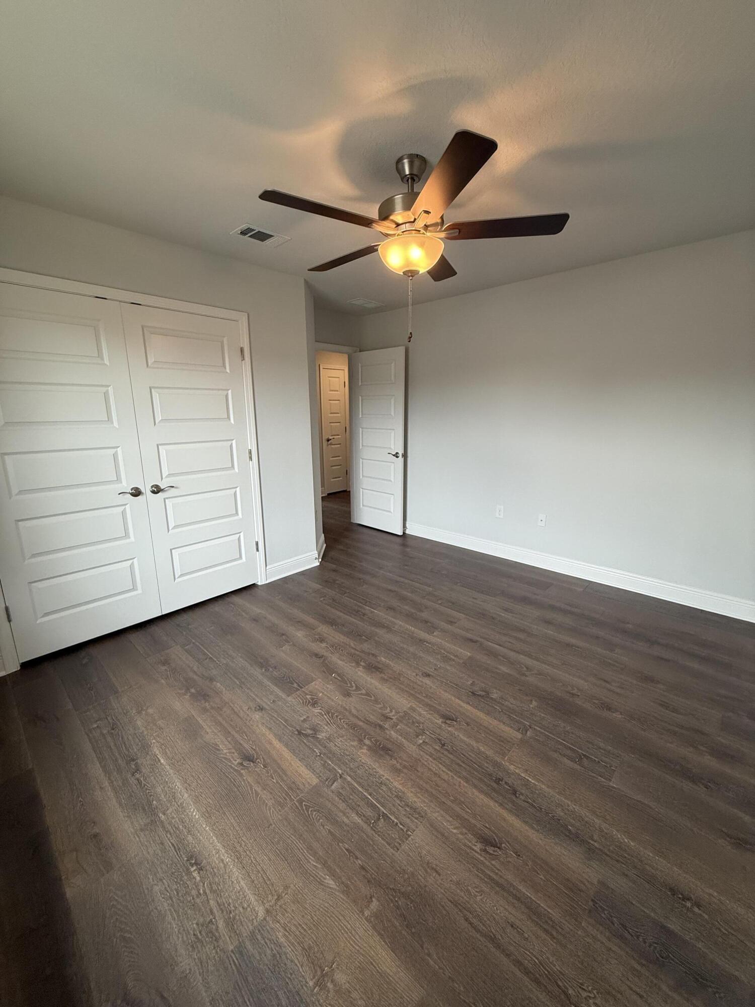 185 Ridgeway Circle Crestview, FL 32536 - Photo 23 of 30 a view of an empty room with a ceiling fan