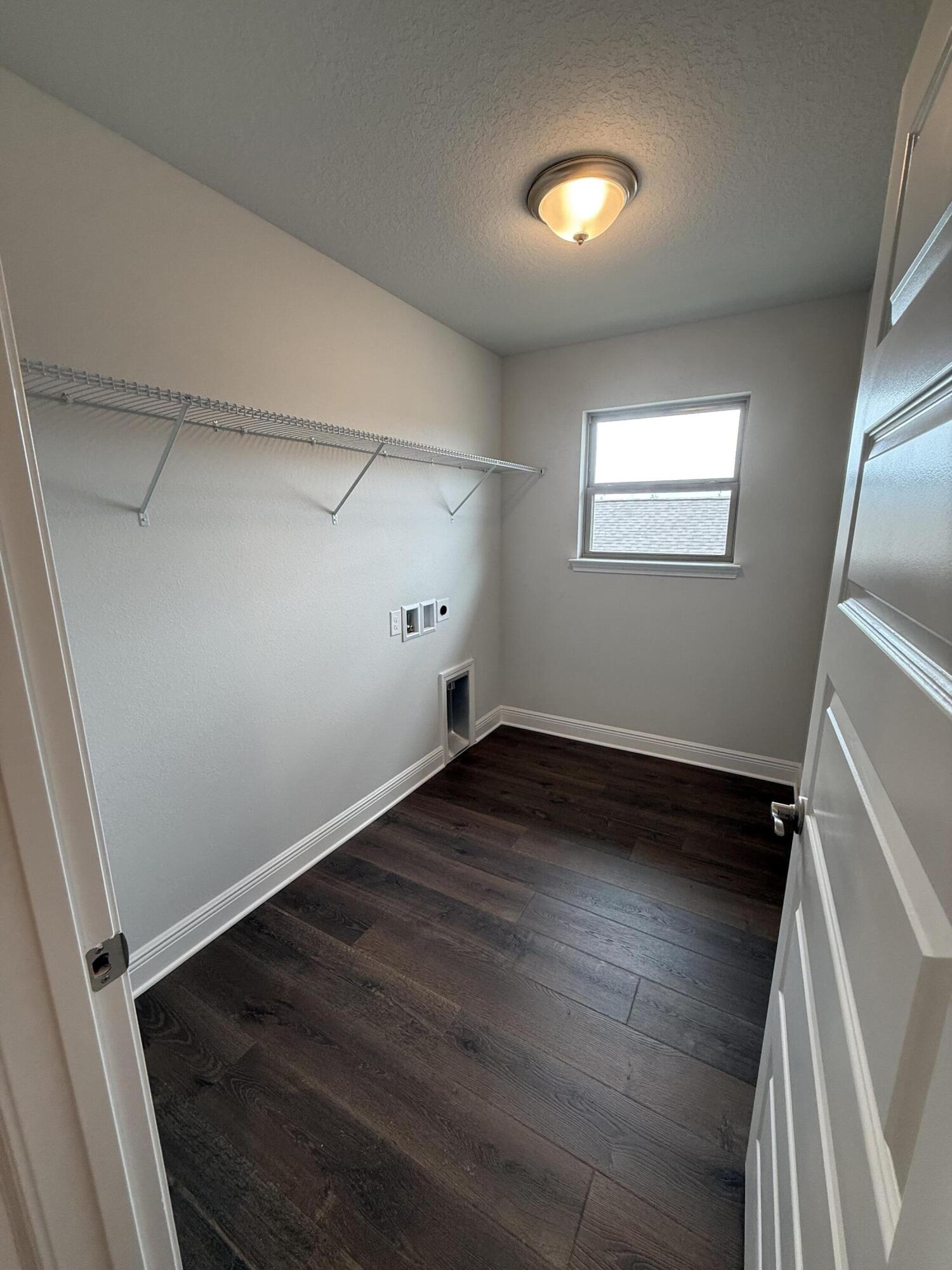 185 Ridgeway Circle Crestview, FL 32536 - Photo 25 of 30 a view of an empty room with wooden floor and a window