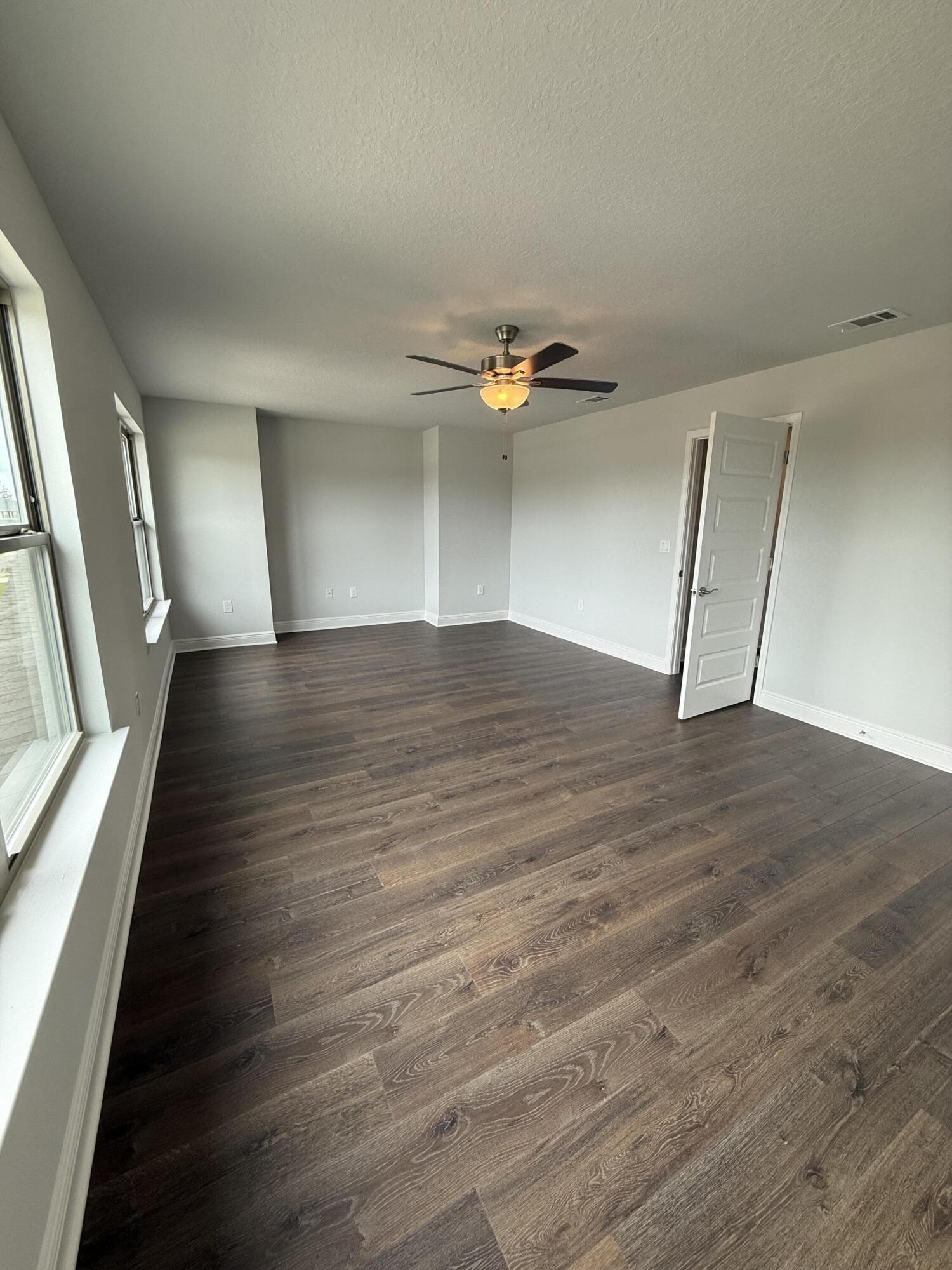 185 Ridgeway Circle Crestview, FL 32536 - Photo 26 of 30 wooden floor in an empty room with a window