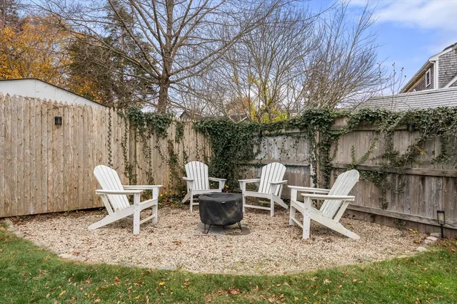 a chairs and a table in the backyard
