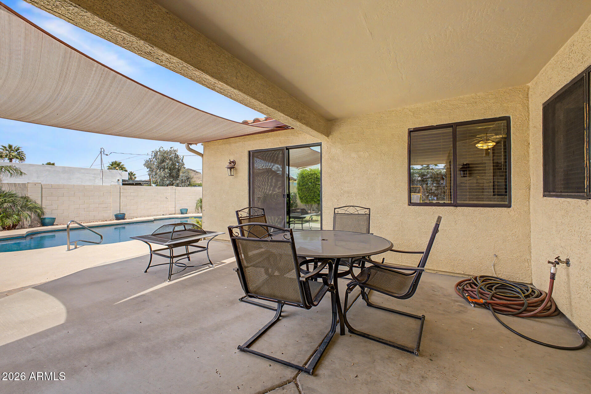 802 East Roberts Road Phoenix, AZ 85022 - Photo 19 of 24 a view of a dining room with furniture and a window
