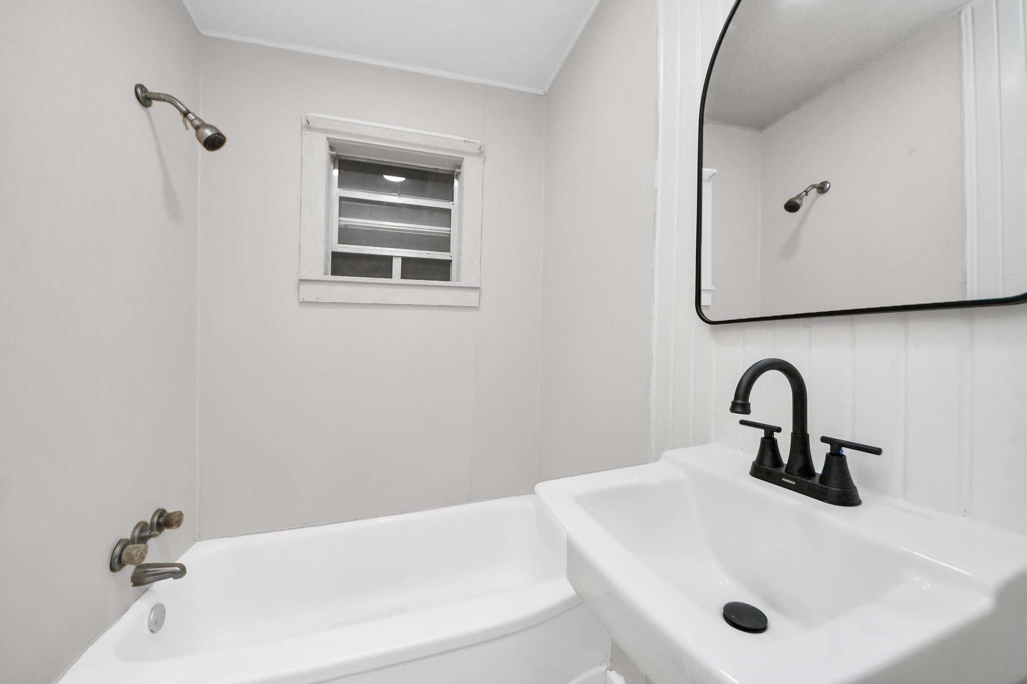 3804 Lila Street Houston, TX 77026 - Photo 12 of 16 a bathroom with a sink and mirror