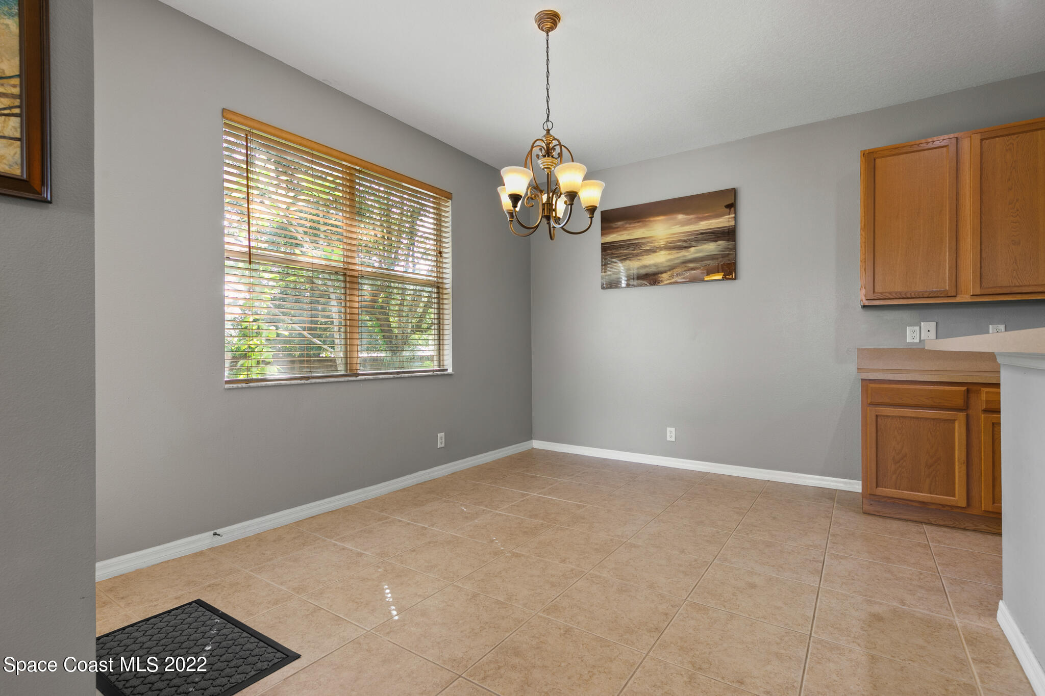 1963 Jupiter Boulevard Southwest Palm Bay, FL 32908 - Photo 11 of 42 a view of livingroom with chandelier