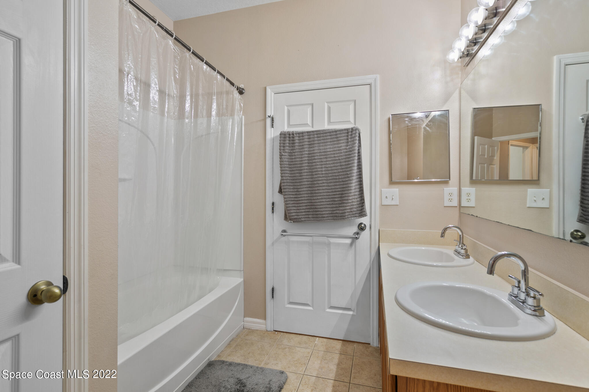 1963 Jupiter Boulevard Southwest Palm Bay, FL 32908 - Photo 23 of 42 a bathroom with a sink a toilet and shower