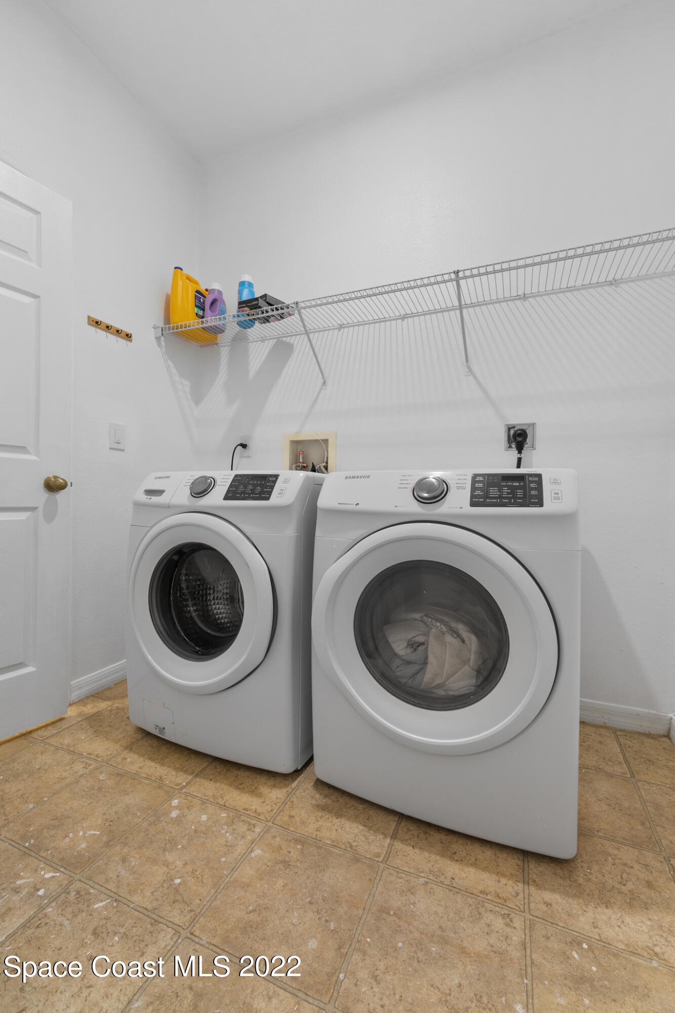 1963 Jupiter Boulevard Southwest Palm Bay, FL 32908 - Photo 25 of 42 a utility room with dryer and washer