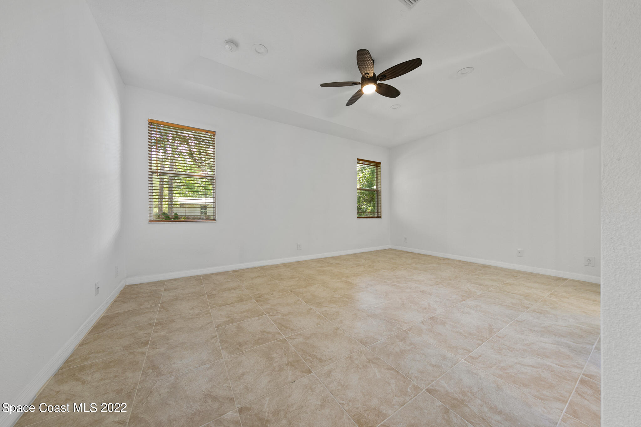 1963 Jupiter Boulevard Southwest Palm Bay, FL 32908 - Photo 27 of 42 a view of empty room with windows