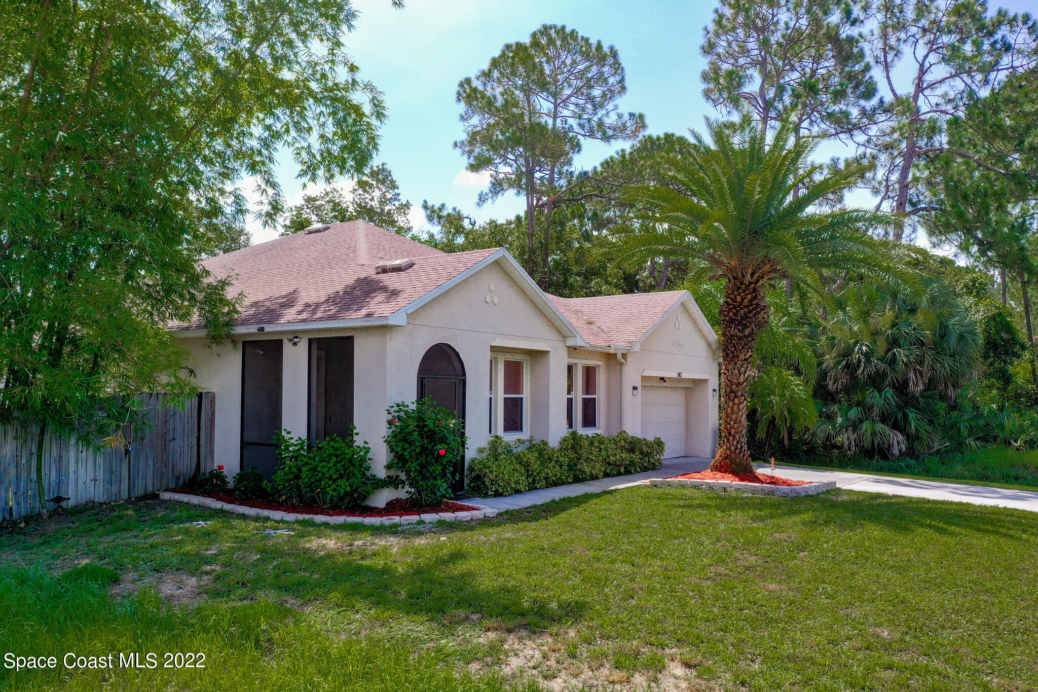 1963 Jupiter Boulevard Southwest Palm Bay, FL 32908 - Photo 34 of 42 a front view of a house with a yard