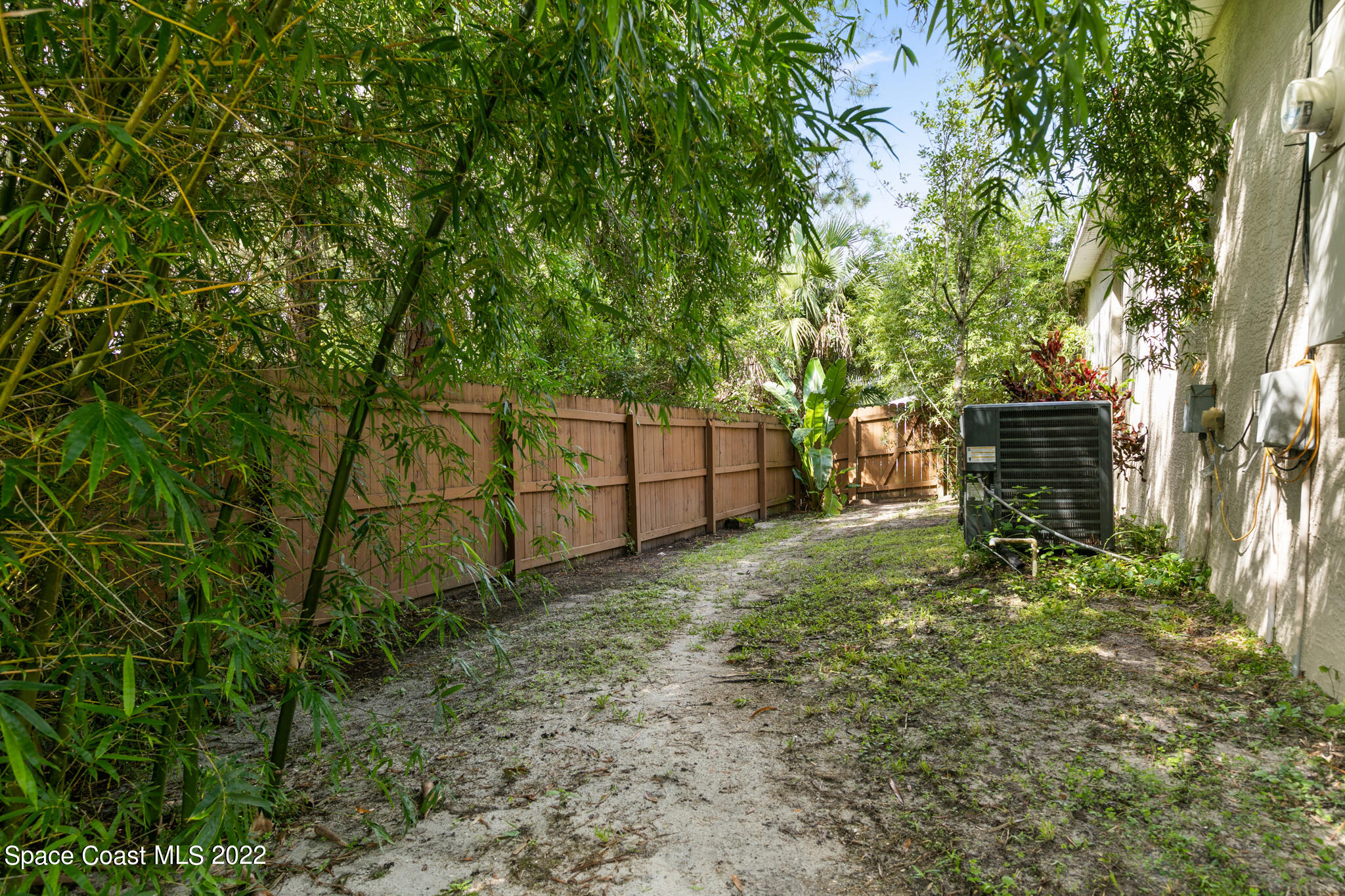 1963 Jupiter Boulevard Southwest Palm Bay, FL 32908 - Photo 37 of 42 a backyard of a house with lots of green space