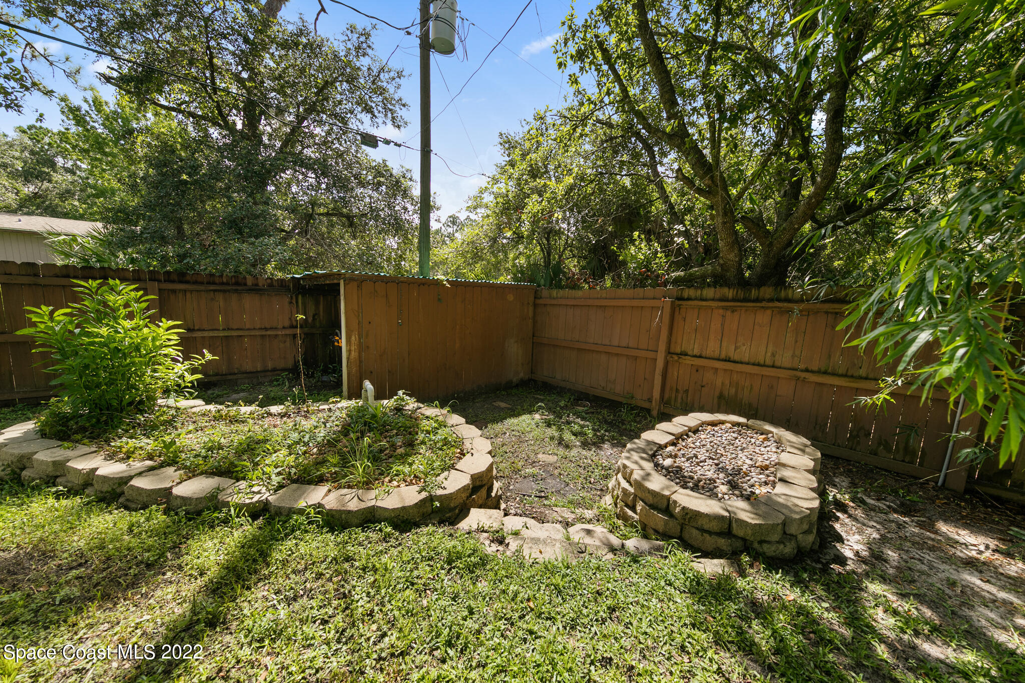 1963 Jupiter Boulevard Southwest Palm Bay, FL 32908 - Photo 41 of 42 a backyard of a house