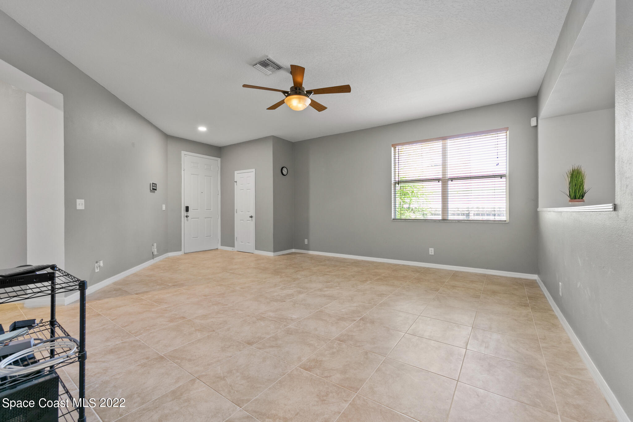 1963 Jupiter Boulevard Southwest Palm Bay, FL 32908 - Photo 7 of 42 a view of an empty room with a window