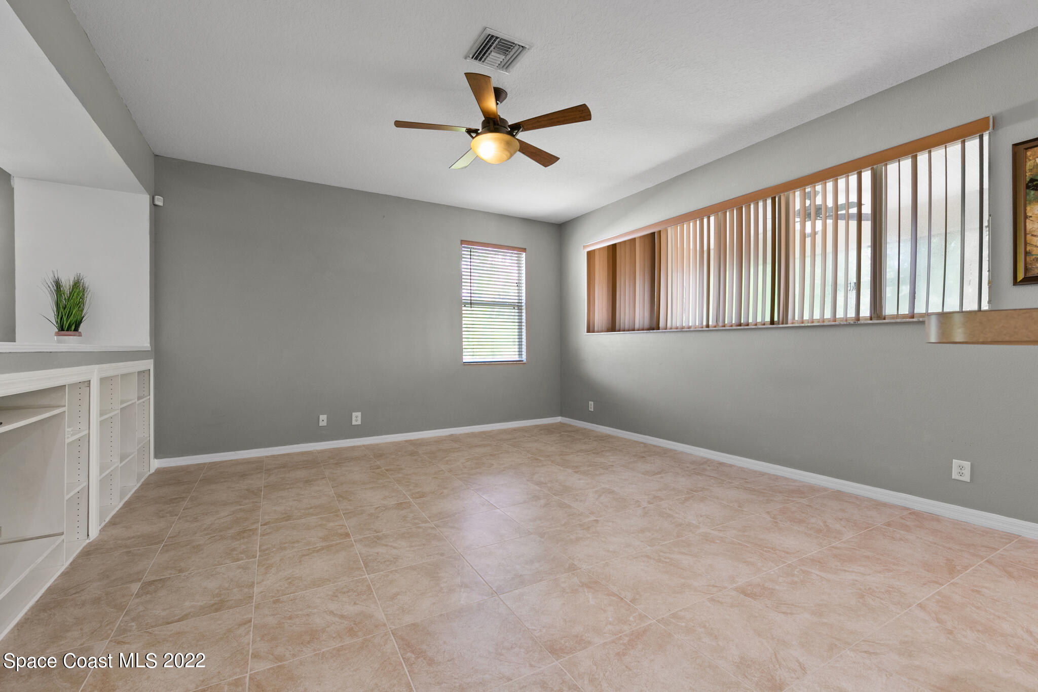 1963 Jupiter Boulevard Southwest Palm Bay, FL 32908 - Photo 8 of 42 a view of an empty room with a window