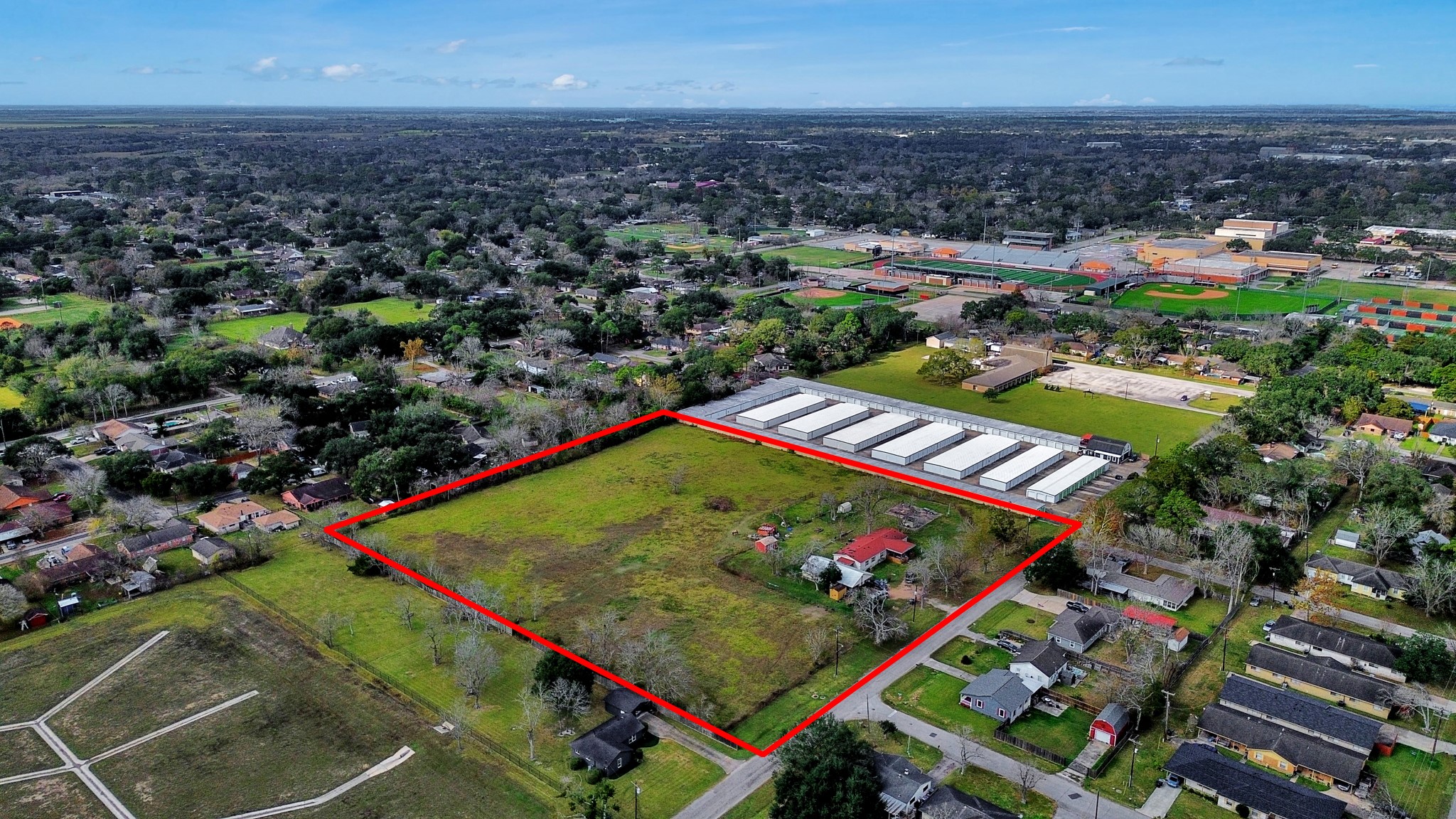 1500 South Durant Street Alvin, TX 77511 - Photo 4 of 5 an aerial view of a tennis ground and a cars park