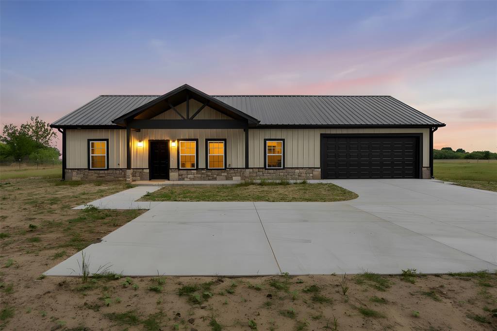 121 Brazier Road Ennis, TX 75119 - Photo 1 of 31 a front view of a house with yard