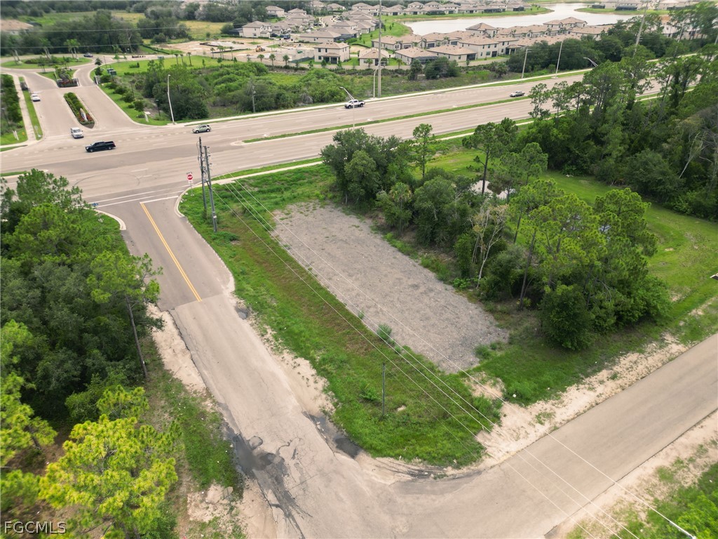 910 Meadow Road Lehigh Acres, FL 33913 - Photo 2 of 12 a view of a garden with a terrace