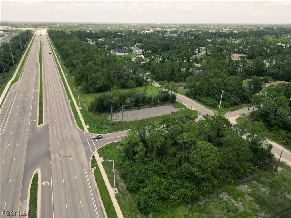 910 Meadow Road Lehigh Acres, FL 33913 - Photo 8 of 12 a view of a yard with an outdoor seating
