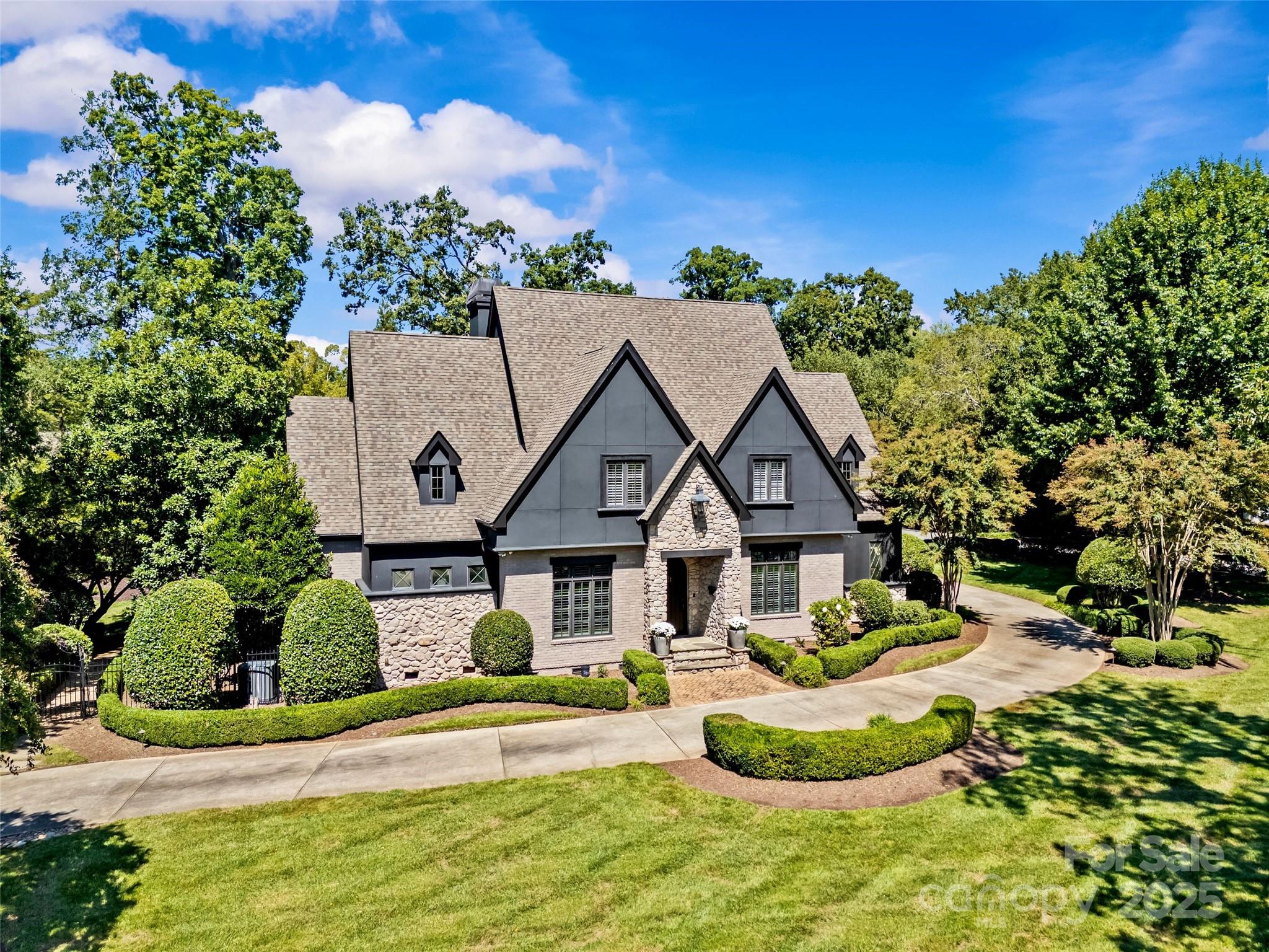 2130 Ferncliff Road Charlotte, NC 28211 - Photo 1 of 3 a front view of a house with a yard