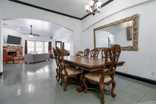 a view of a a dining room with furniture window and wooden floor