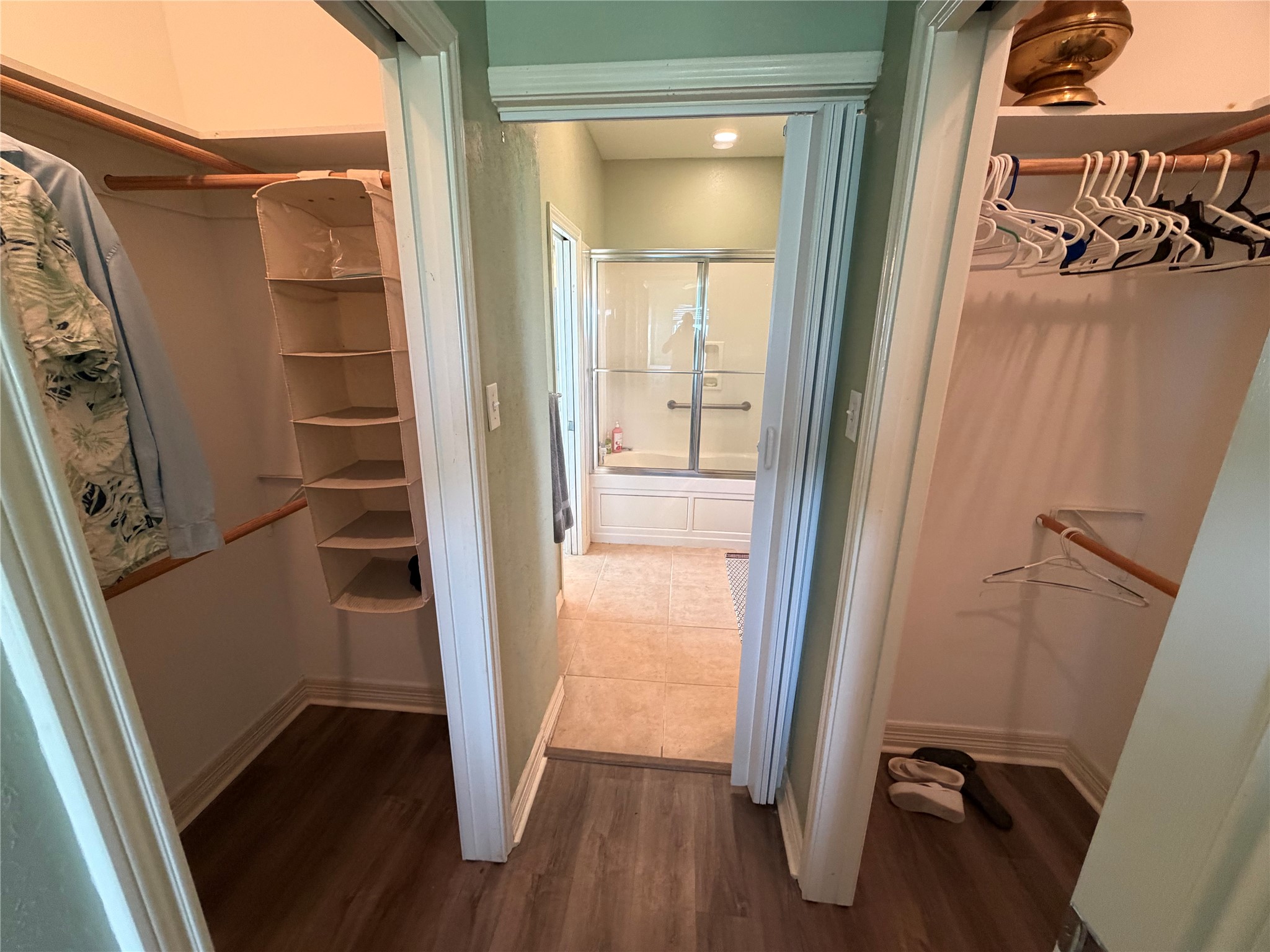 979 Rancho Carribe Drive Crystal Beach, TX 77650 - Photo 30 of 50 Hallway to master bath with his in her closets on either side