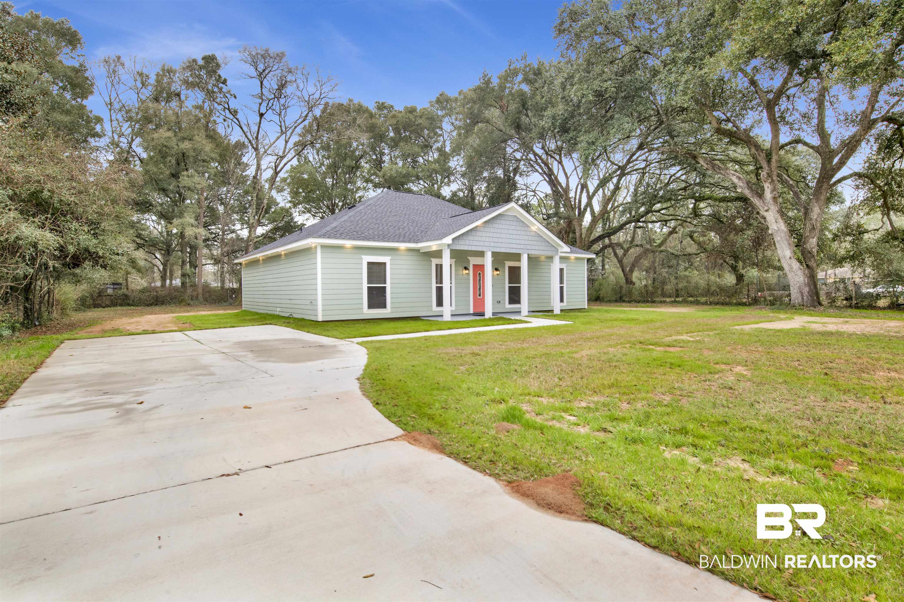 10871 Somerset Road Grand Bay, AL 36541 - Photo 25 of 31 View of front of house featuring a front lawn and a porch