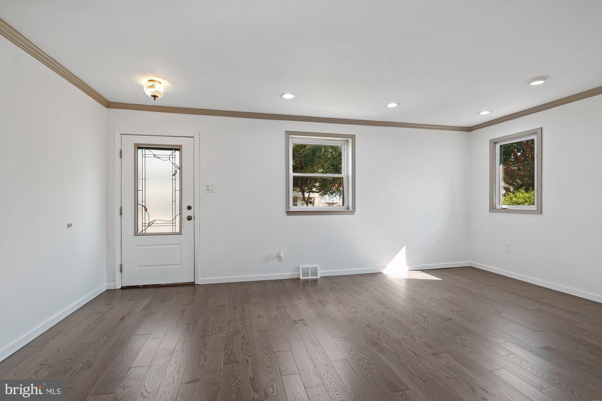9722 Morefield Road Philadelphia, PA 19115 - Photo 3 of 36 Living room has new hardwood floor & crown molding