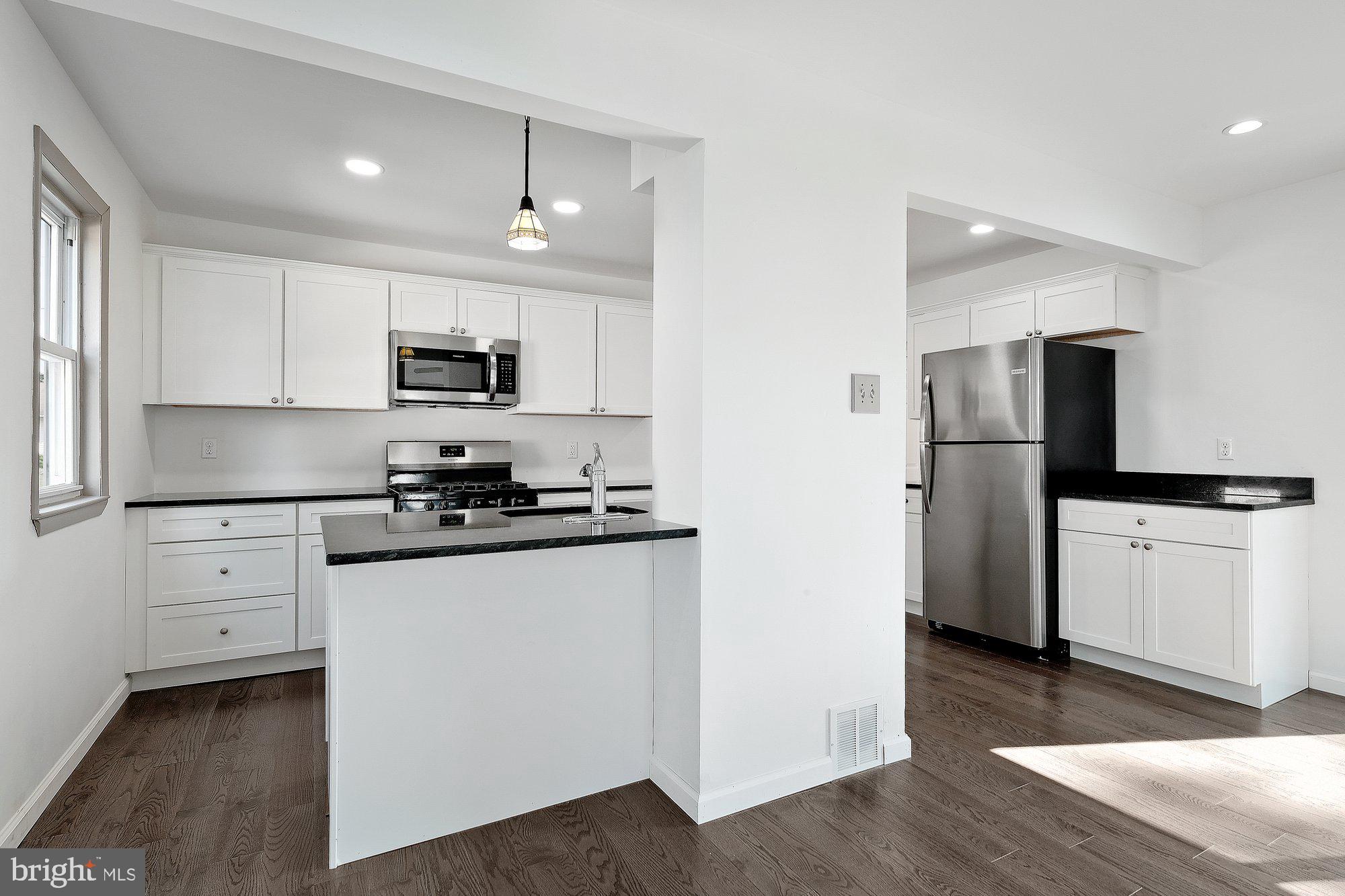 9722 Morefield Road Philadelphia, PA 19115 - Photo 10 of 36 New hardwood floor & recessed lighting