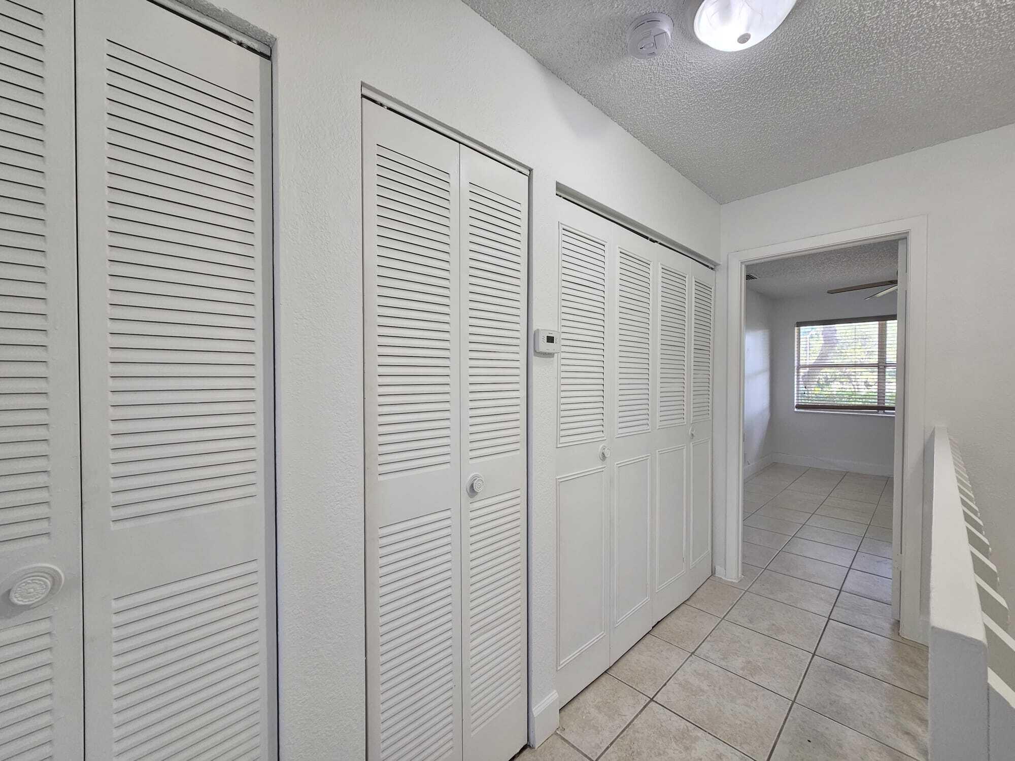 6342 Walk Circle Boca Raton, FL 33433 - Photo 8 of 10 a view of a bathroom with sink and mirror