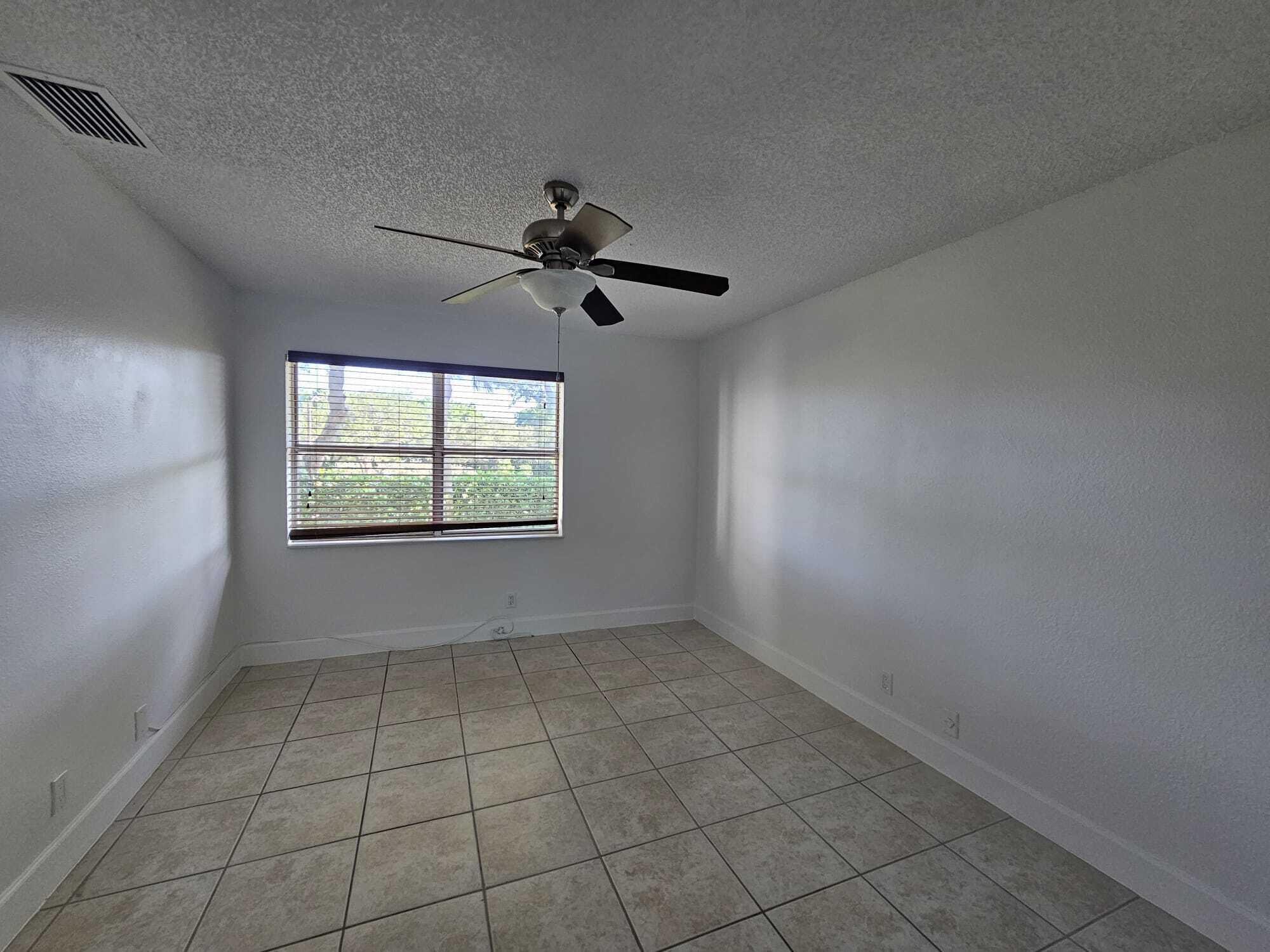 6342 Walk Circle Boca Raton, FL 33433 - Photo 9 of 10 a view of an empty room with a window