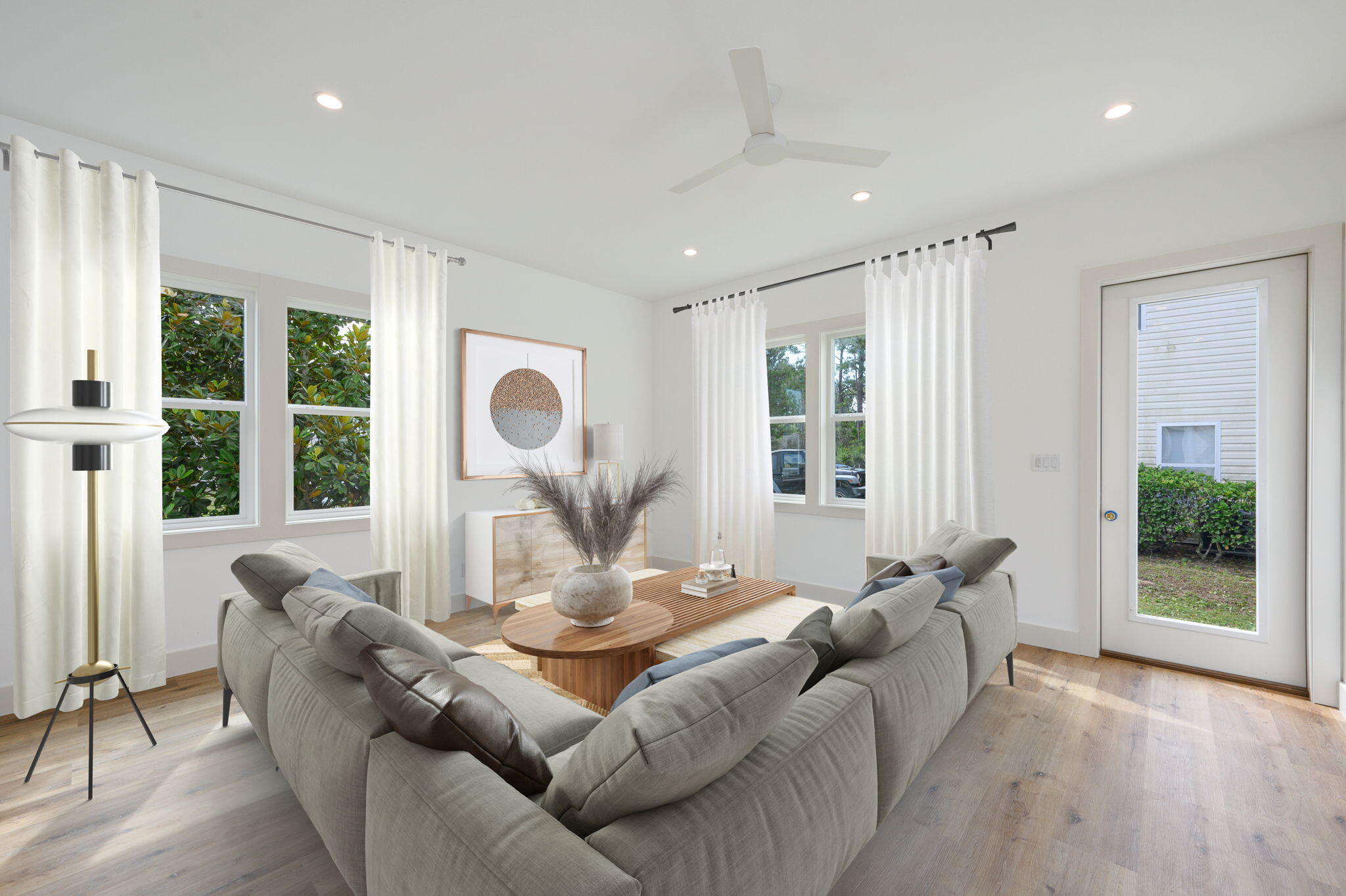 114 Enchanted Way Santa Rosa Beach, FL 32459 - Photo 3 of 38 a living room with furniture and large windows