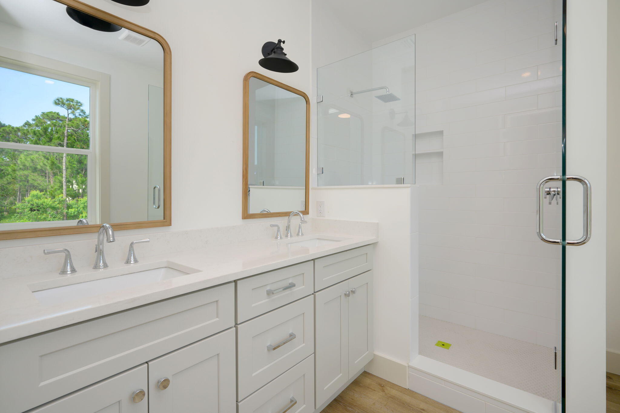 114 Enchanted Way Santa Rosa Beach, FL 32459 - Photo 31 of 38 a bathroom with a shower sink and mirror