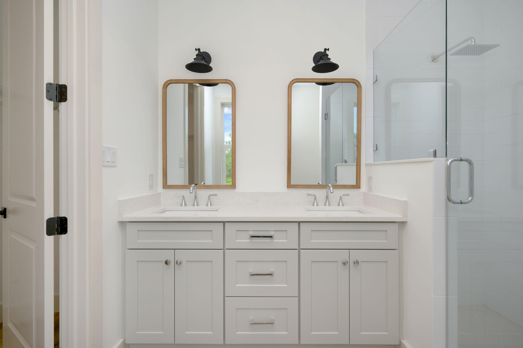 114 Enchanted Way Santa Rosa Beach, FL 32459 - Photo 32 of 38 a bathroom with double vanity sinks a toilet a mirror and window