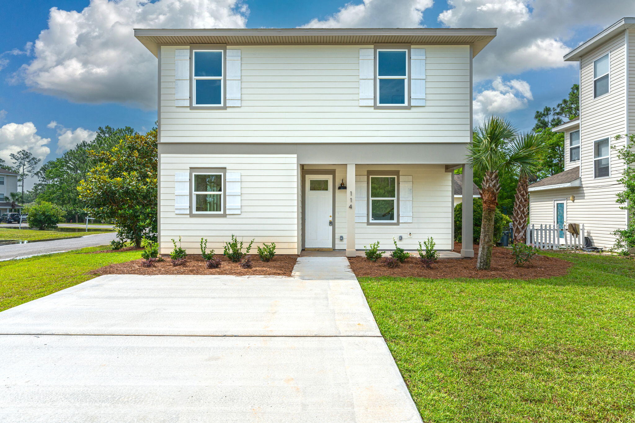 114 Enchanted Way Santa Rosa Beach, FL 32459 - Photo 38 of 38 a front view of house with yard and green space