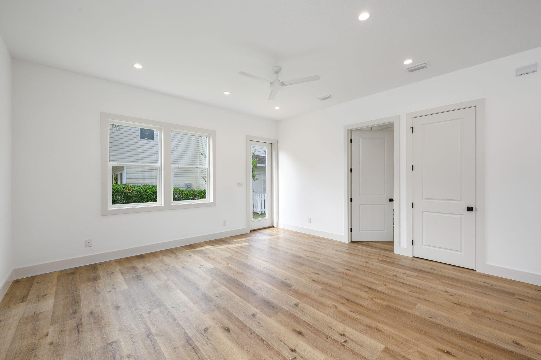 114 Enchanted Way Santa Rosa Beach, FL 32459 - Photo 10 of 38 a view of an empty room with wooden floor and a window