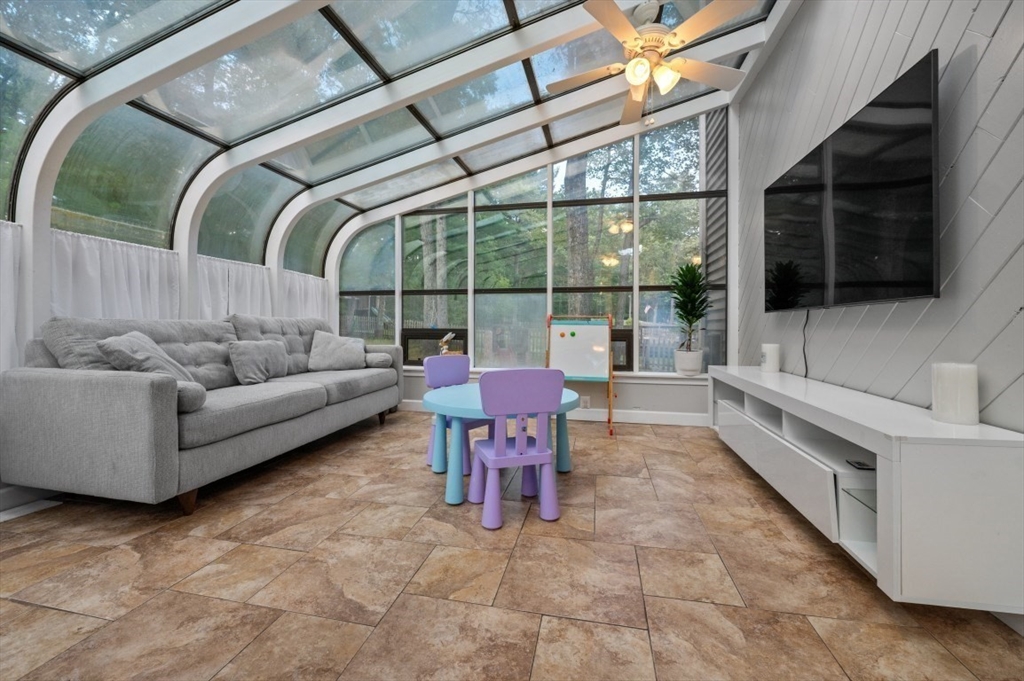 16 Sherborne Circle Ashland, MA 01721 - Photo 18 of 35 a balcony with furniture and a flat screen tv