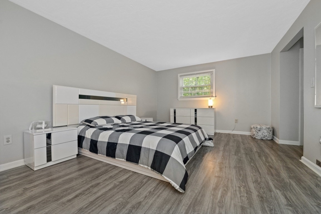 16 Sherborne Circle Ashland, MA 01721 - Photo 19 of 35 a bedroom with a bed and wooden floor