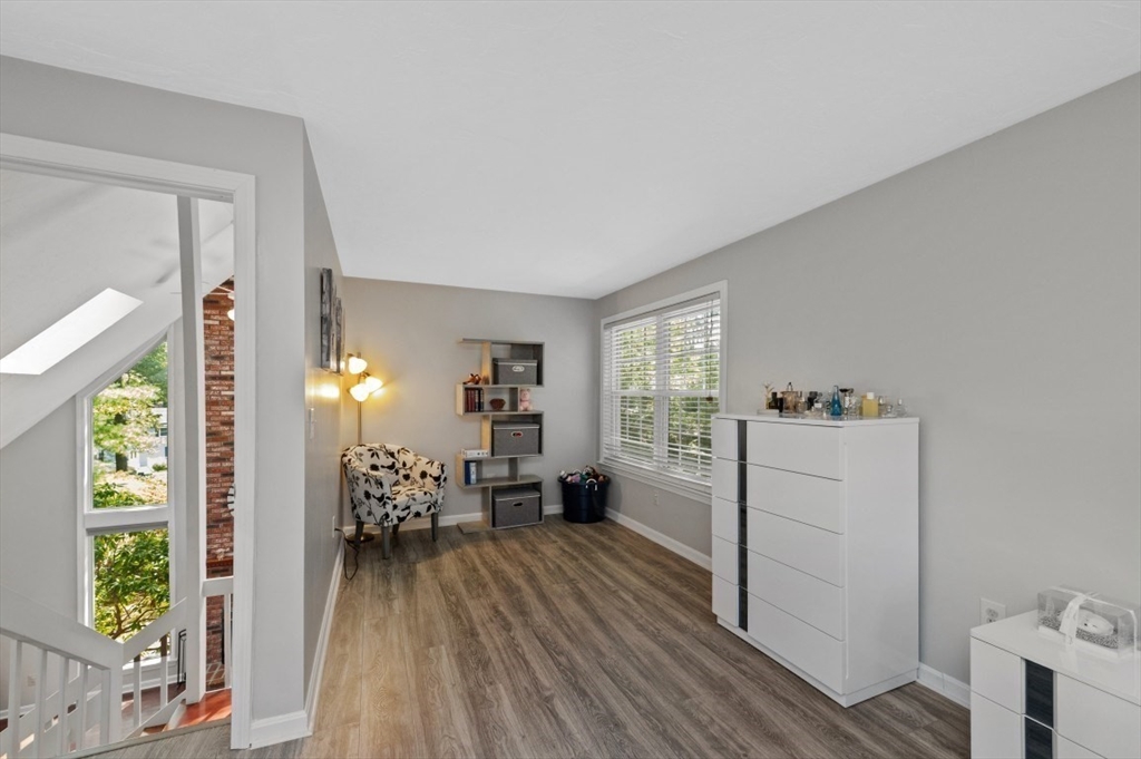 16 Sherborne Circle Ashland, MA 01721 - Photo 21 of 35 a room with furniture a window and a wooden floor