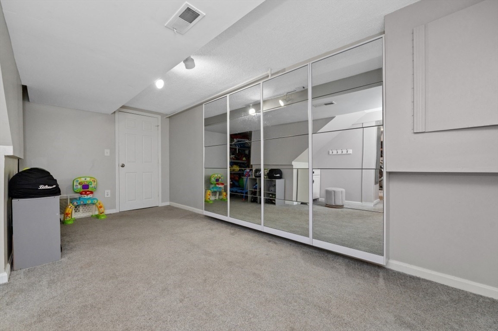 16 Sherborne Circle Ashland, MA 01721 - Photo 29 of 35 a view of an empty room with a window