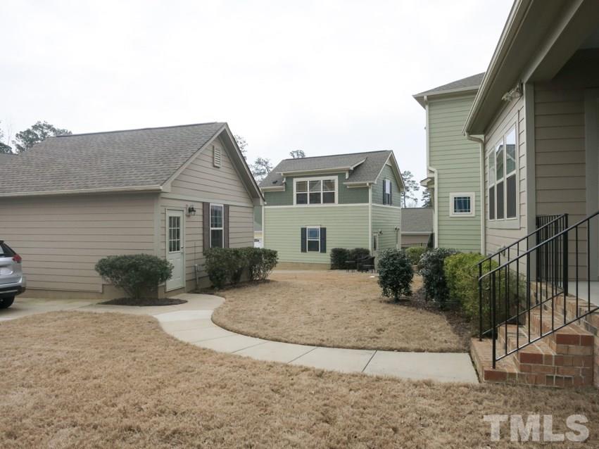 1556 Rodessa Run Raleigh, NC 27607 - Photo 21 of 25 Level backyard w/2-car garage + extra parking pad and NO yard maintenance!