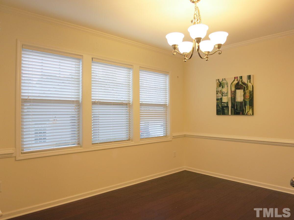 1556 Rodessa Run Raleigh, NC 27607 - Photo 6 of 25 The sunny Dining Area has a door to the covered rear Porch - ideal for grilling & entertaining!